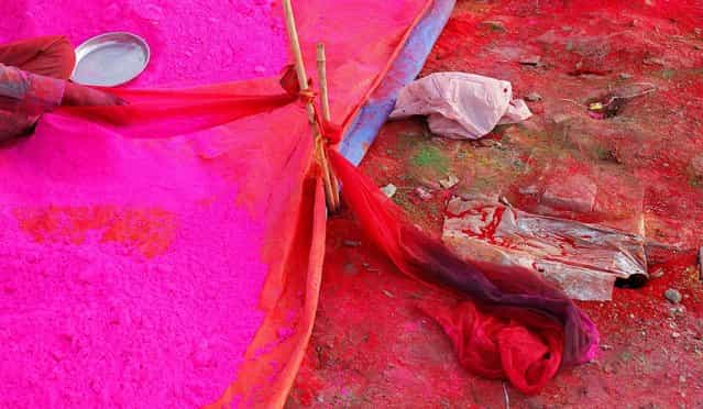 Laborers prepare colored powder for the upcoming Holi festival in Allahabad, India, on March 22, 2013. (Photo by Rajesh Kumar Singh/Associated Press)