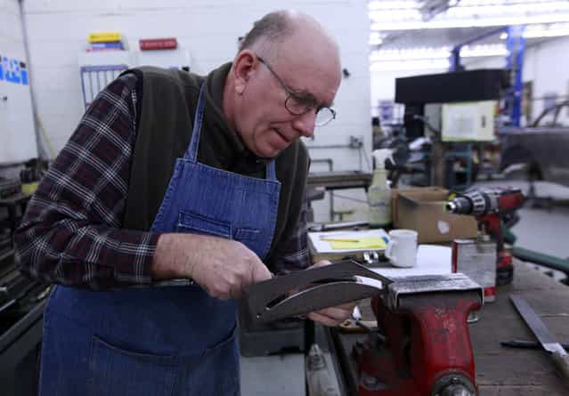 Robert Triplett creates a part for a door on a 1937 Rolls Royce Tuesday, March 5, 2013 at L'Cars Automotive Specialties in Cameron, Wis. The company which does high-end restoration and customization work classic cars that have won awards at the world-renowned Pebble Beach Concours d'Elegance. Winning cars include a 57c Bugatti, Rolls Royce PIII V12, V12 Aero coupe, T44 Bugatti, T55 Bugatti, T38A Bugatti, Mercedes Benz 290 Roadster, Rolls Royce Silver Ghost, T57 Bugatti, 1929 Duesenberg J, Mercedes Benz 540K cabriolet, Talbot Teardrop and a 1931 V16 Cadillac convertible. (Photo by Mark Hoffman)