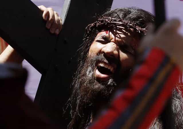 An India Christian devotee reenacts the sufferings of Jesus Christ on the occasion of Good Friday in Mumbai, India, Friday, March 29, 2013. Christians all over the world are marking Good Friday, the day when Christ was crucified. (Photo by Rajanish Kakade/AP Photo)
