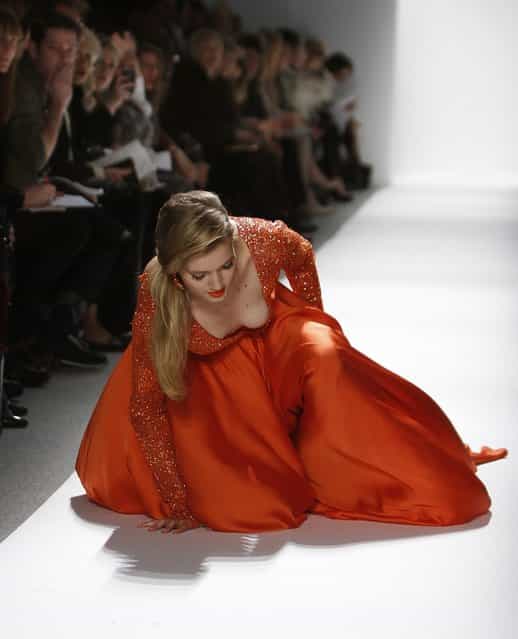 A model falls while presenting a creation at the Dennis Basso Fall/Winter 2012 collection show during New York Fashion Week February 14, 2012. (Photo by Carlo Allegri/Reuters)