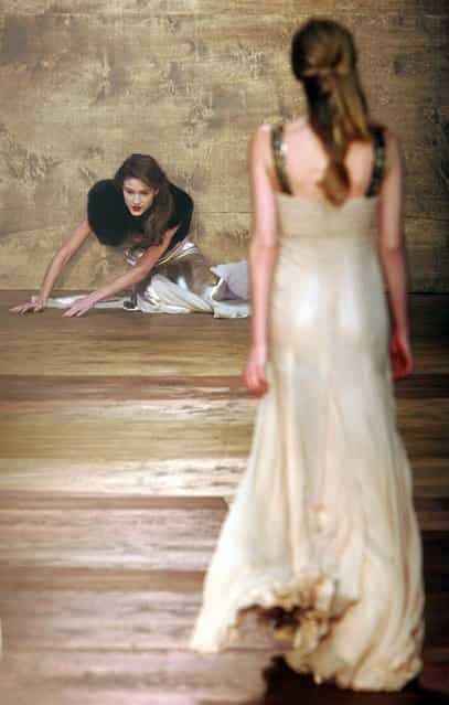 A model falls as she wears a creation by designer Amanda Wakeley at her autumn/winter 2006 show during London Fashion Week in London February 14, 2006. (Photo by Stephen Hird/Reuters)