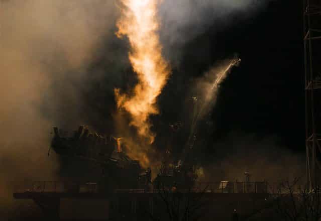 The Soyuz-FG rocket booster with the Soyuz TMA-08M spaceship carrying a new crew to the International Space Station blasts off at the Russian leased Baikonur cosmodrome in Kazakhstan, on March 29, 2013. The Russian rocket carries Russian cosmonauts Alexander Misurkin, Pavel Vinogradov and U.S. astronaut Christopher Cassidy. (Photo by Dmitry Lovetsky/Associated Press)