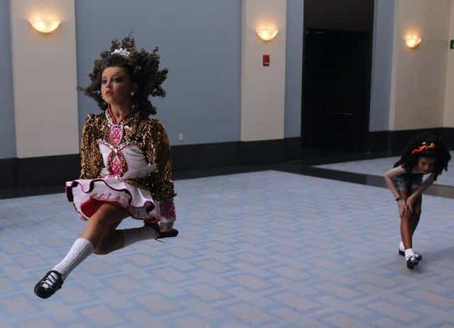 Competitors warm up in the hallway at the World Irish Dancing Championships in Boston, Massachusetts March 24, 2013. (Photo by Jessica Rinaldi/Reuters)