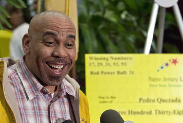 Pedro Quezada, winner of the Powerball lottery, smiles as he attends a news conference at the New Jersey Lottery headquarters in Trenton, March 26, 2013. A New Jersey convenience store owner has stepped forward to claim the winning ticket in the $338 million Powerball lottery, according to media reports. Pedro Quezada, 44, walked into a Passaic, New Jersey, liquor store where the winning ticket was sold and handed a ticket over to be validated late Monday afternoon, The Bergen Record newspaper reported. (Photo by Eduardo Munoz/Reuters)