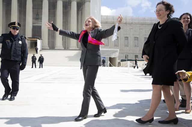 Edie Windsor, plaintiff in the hearing against the Defense of Marriage Act, celebrates after arguments outside the Supreme Court in Washington on March 27, 2013. When Edith Windsor got engaged in the 1960s to the woman who eventually became her wife she asked for a pin instead of a ring. A ring would have meant awkward questions, she said: Who is he? And when do we meet him? On Wednesday, the 83-year-old stood in front of the U.S. Supreme Court, the face of a case that could change how the U.S. government treats married gay couples. Windsor, whose wife Thea Spyer died in 2009, sued to challenge a $363,000 federal estate tax bill she got after Spyer's death. The pair married in Canada in 2007. Had Windsor been married to a man she would not have paid any estate tax. (Photo by Joshua Roberts/Reuters) Edie Windsor, plaintiff in the hearing against the Defense of Marriage Act, celebrates after arguments outside the Supreme Court in Washington on March 27, 2013. When Edith Windsor got engaged in the 1960s to the woman who eventually became her wife she asked for a pin instead of a ring. A ring would have meant awkward questions, she said: Who is he? And when do we meet him? On Wednesday, the 83-year-old stood in front of the U.S. Supreme Court, the face of a case that could change how the U.S. government treats married gay couples. Windsor, whose wife Thea Spyer died in 2009, sued to challenge a $363,000 federal estate tax bill she got after Spyer's death. The pair married in Canada in 2007. Had Windsor been married to a man she would not have paid any estate tax. (Photo by Joshua Roberts/Reuters)