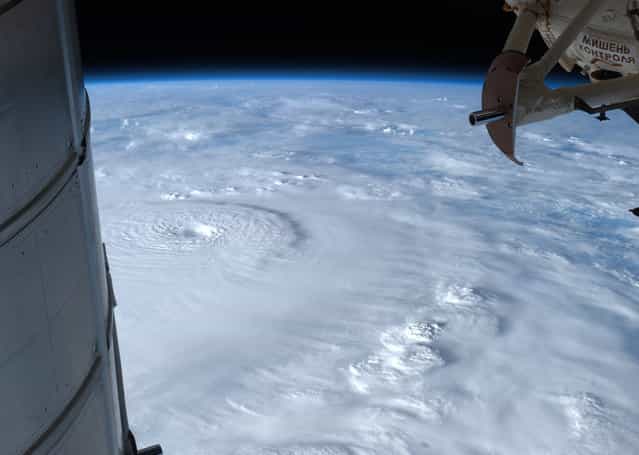 Typhoon Bopha moves toward the Philippines, observed from the ISS, on December 2, 2012. (Photo by AP Photo/NASA/The Atlantic)