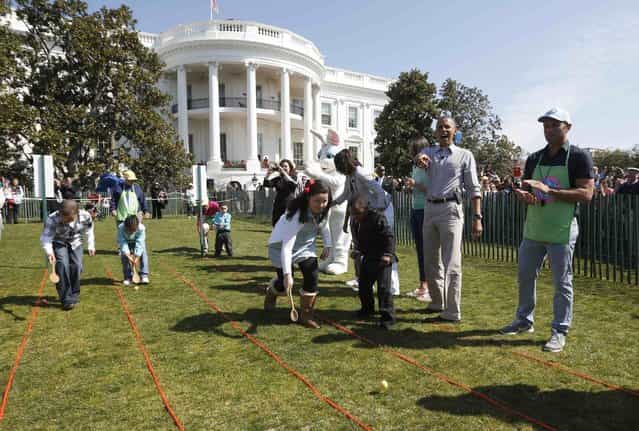 U.S. President Barack Obama (2nd R) participates in the 135th annual Easter Egg Roll on the South Lawn of the White House in Washington, April 1, 2013. (Photo by Jason Reed/Reuters)