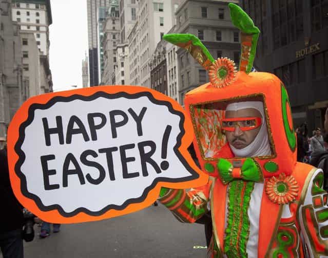 Performance artist Davey Mitchell, dressed up as [iBunny], poses for photos while taking part in the Easter Bonnet Parade in New York March 31, 2013. (Photo by Carlo Allegri/Reuters)