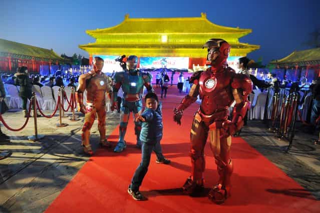 This picture taken on April 6, 2013 shows a boy posing during a promotional event for the Hollywood movie [Iron Man 3] at the Forbidden City in Beijing. (Photo by Wang Zhao/AFP Photo)