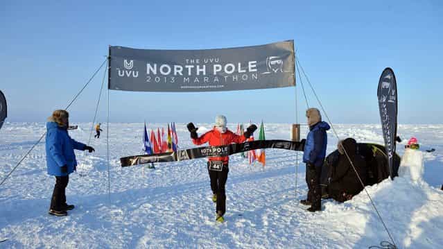 Handout photo of Gary Thornton, winning The UVU 2013 North Pole Marathon, on April 11, 2013. Known as the world's coolest marathon, the marathon took place just after midnight on April 9th. The 42.195km event was won by Mr. Thornton in a time of 3 hrs 49 minutes. Fiona Oakes, Great Britain, won the female division. Competitors experienced continual daylight at the geographic North Pole and ran a very challenging course in soft snow. Armed guards kept watch for polar bears. (Photo by Mike King/PA Wire)
