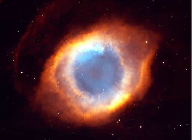 This photograph of the coil-shaped Helix Nebula is one of the largest and most detailed celestial images ever made. The composite picture is a seamless blend of ultra-sharp images from NASA's Hubble Space Telescope combined with the wide view of the Mosaic Camera on the National Science Foundation's 0.9-meter telescope at Kitt Peak National Observatory near Tucson, Ariz. (Photo by NASA/WireImage)