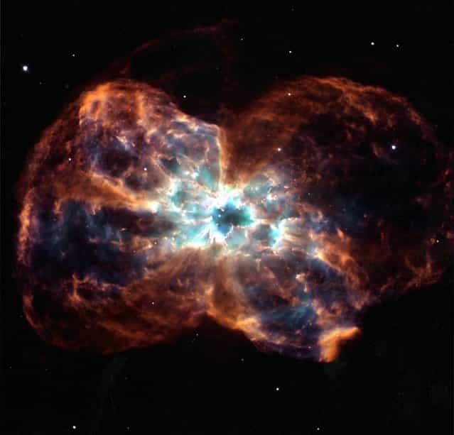 This image, taken by the NASA/ESA Hubble Space Telescope February 6, 2007, shows the planetary nebula NGC 2440 – the chaotic structure of the demise of a star, a colorful [last Hurray] of a star like our Sun. (Photo by AP Photo/Hubble)