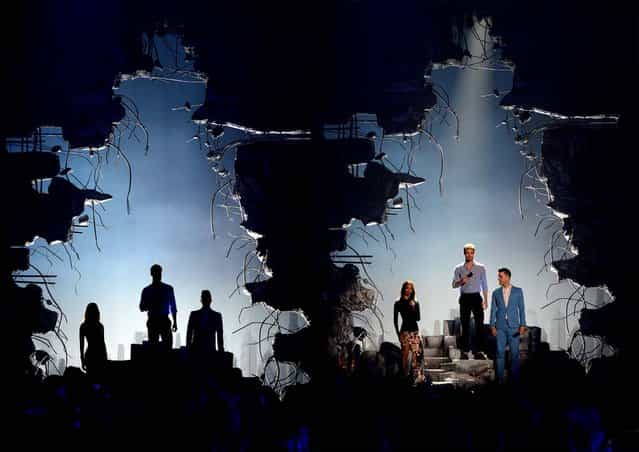 Zoe Saldana, Chris Pine and Zachary Quinto appear onstage at the MTV Movie Awards. (Photo by Jordan Strauss/Invision for MTV)