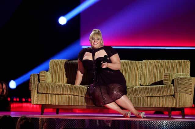 Host Rebel Wilson, who won the award for breakthrough performance, speaks onstage. (Photo by Matt Sayles/Invision)