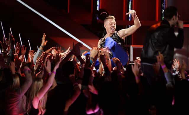 Macklemore performs at the MTV Movie Awards. (Photo by Matt Sayles/Invision)