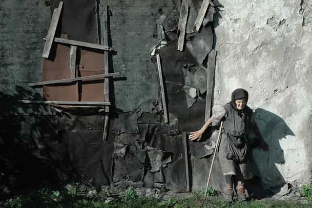 [His house]. Deaf-blind resident of the village Bolshedmitrovka, Russia, near his home. (Photo by Andrej Arhipov)