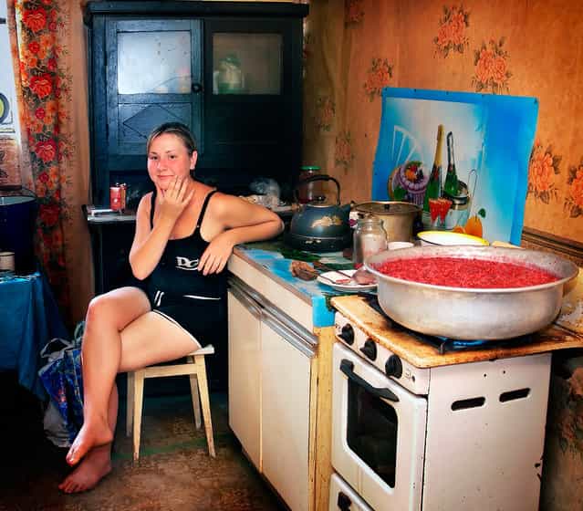 [Hostess of the sweet]. The girl cooks jam. (Photo by Aleksandr Makarenko)
