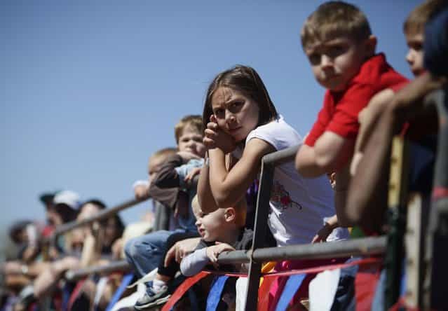Spectators prepare to watch the ostrich race during the annual Ostrich Festival in Chandler, Arizona March 10, 2013. (Photo by Joshua Lott/Reuters)