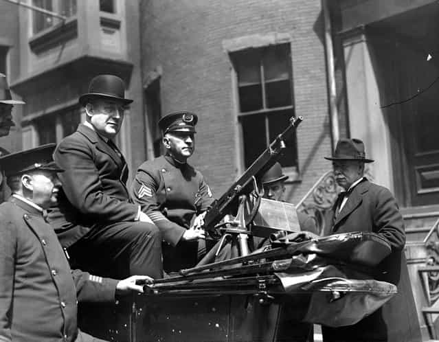 Superintendent Michael Crowley with machine gunners at headquarters. They are ready for big May Day riots, 1920. (Photo by Leslie Jones)