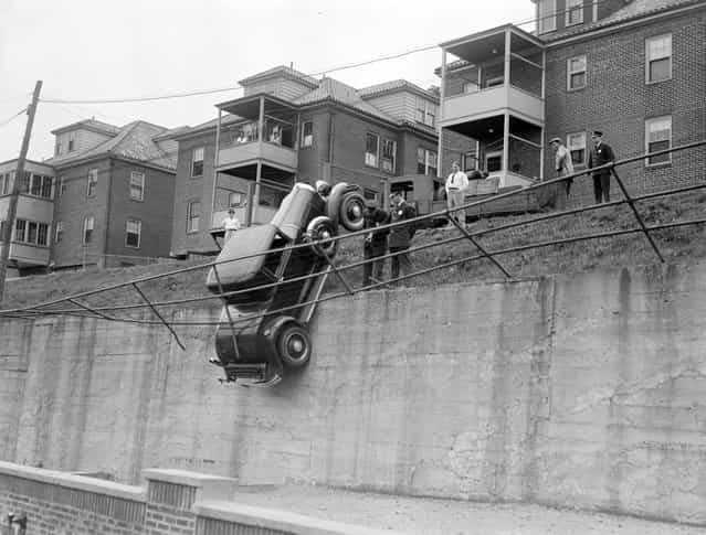 Fence keeps car from falling, Brookline, 1931. (Photo by Leslie Jones)