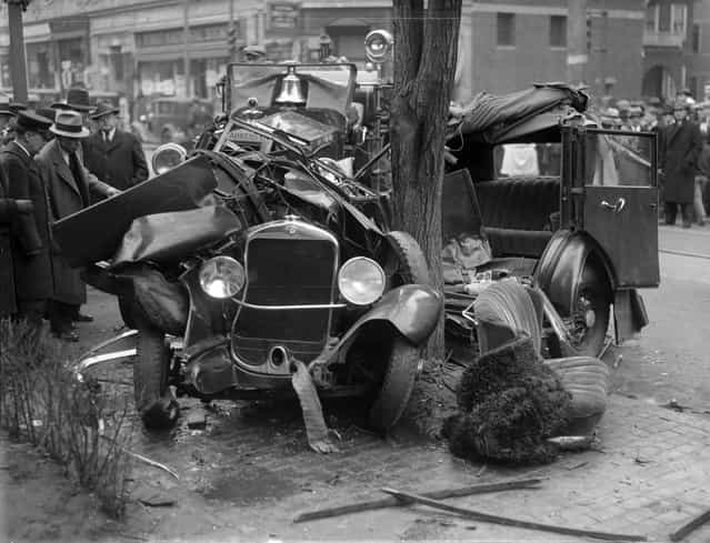 Auto wrapped around tree, 1933. (Photo by Leslie Jones)