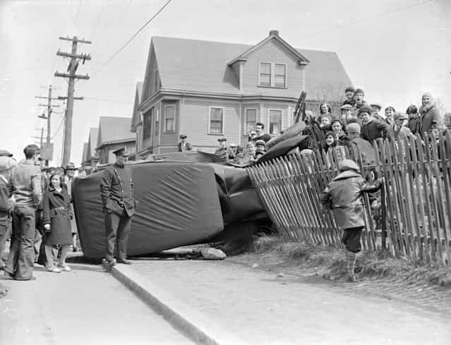 Car goes through fence, 1931. (Photo by Leslie Jones)