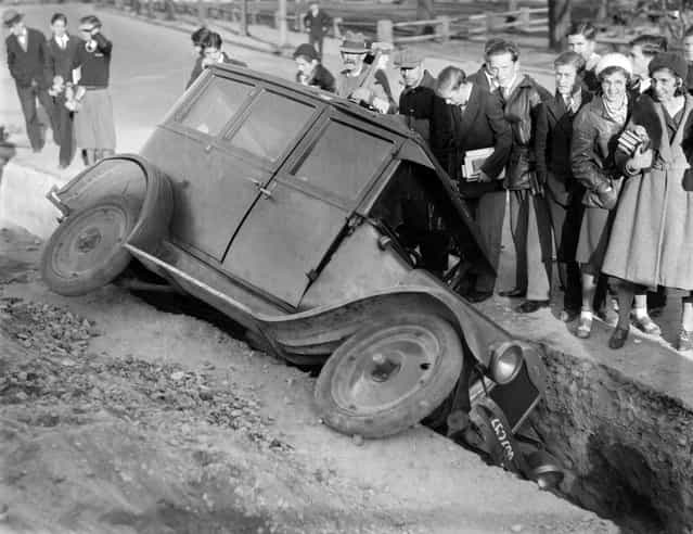 Auto goes into trench in Peabody Sq., 1931. (Photo by Leslie Jones)