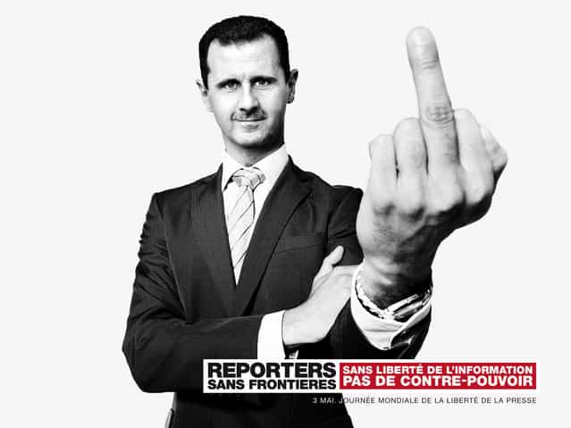 Reporters Without Borders exposes montages of world leaders, including Mahmoud Ahmadinejad (Iran), Xi Jinping (China) and Bashar al-Assad (Syria) and Vladimir Putin (Russia) in Paris, marking the 20th World Day of Freedom Media. (Photo by Vincent Bousserez/Reporters Without Borders)