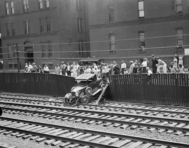 Auto goes out of control and crashes through fence onto B&A Tracks near Greenwich Park, South End, 1934. (Photo by Leslie Jones)