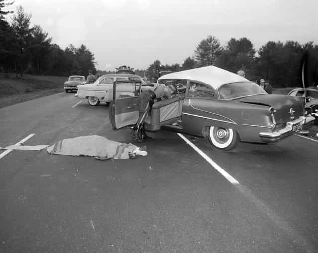 Car/body on street, 1950s. (Photo by Leslie Jones)