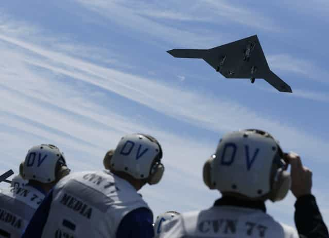 An X-47B pilot-less drone combat aircraft is launched for the first time off an aircraft carrier, the USS George H. W. Bush, in the Atlantic Ocean off the coast of Virginia, May 14, 2013. The U.S. Navy made aviation history on Tuesday by catapulting an unmanned jet off an aircraft carrier for the first time, testing a long-range, stealthy, bat-winged plane that represents a jump forward in drone technology. (Photo by Jason Reed/Reuters)