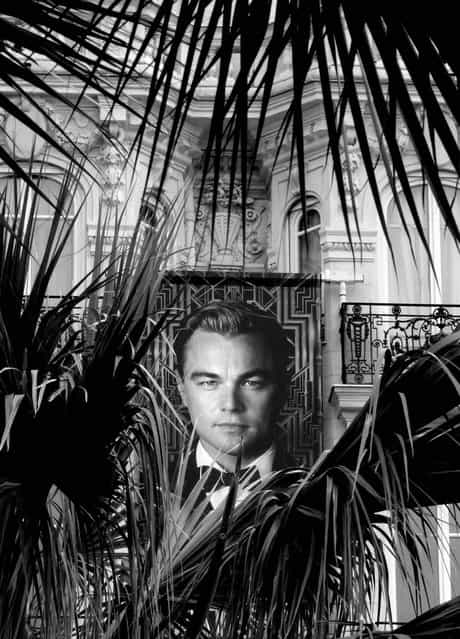 A poster of Leonardo Dicaprio is seen through palm trees in Cannes. (Photo by Virginia Mayo/Associated Press)