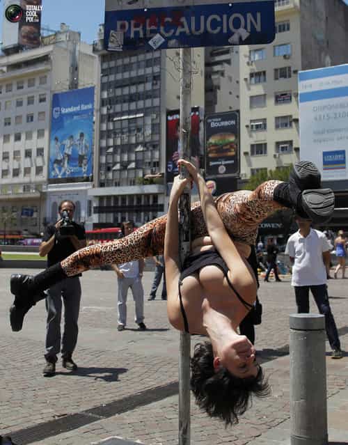 Zully Ochoa performs a pole dancing routine to promote the Miss Pole Dancing Southamerica 2010 competition in Buenos Aires November 5, 2010. (Photo by Enrique Marcarian/Reuters)