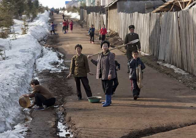 Begaebong is a place in the north of North Korea, where local people can find a ski resort. It is the place to start the visits to Mount Paektu. I was there in may and the weather was still snowy and icy, and even if this area is supposed to be one of the best with new houses, huge sports equiments, you still can see people using snow to clean. (Photo and caption by Eric Lafforgue)