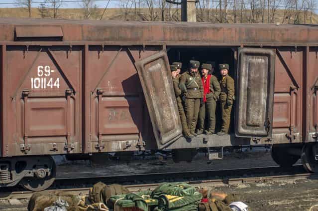 Female soldiers stand in a train car outside of Pyongyang, Feburary 2012. (Eric Testroete)