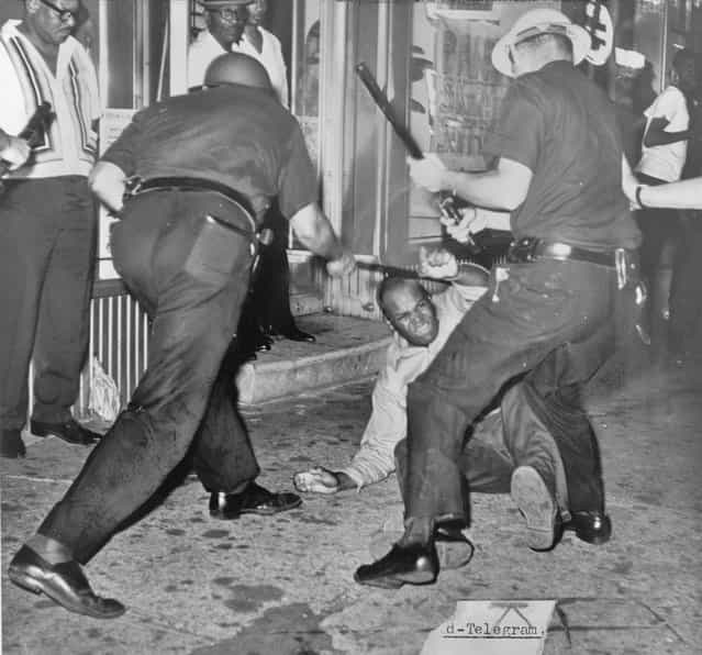 An incident at 133rd Street and Seventh Avenue during the Harlem Riot of 1964. (Photo by Dick DeMarsico/New York World Telegraph & Sun)