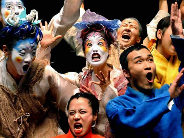 The cast of the Korean theatre company Yohangza performs Shakespeare's A Midsummer Night's Dream at a preview before the opening of their season in Melbourne, Australia. (Photo by William West/AFP Photo)