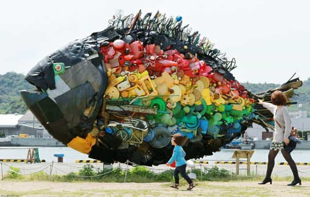 A large sea bream object, made from colourful debris found drifting at sea, such as plastic tanks, toys and wires, and produced by Japanese art group Yodogawa Tecnique, is displayed at the Setouchi Triennale art event at the port of Uno, Okayama prefecture in western Japan on May 19, 2013. (Photo by Jiji Pres/AFP Photo)