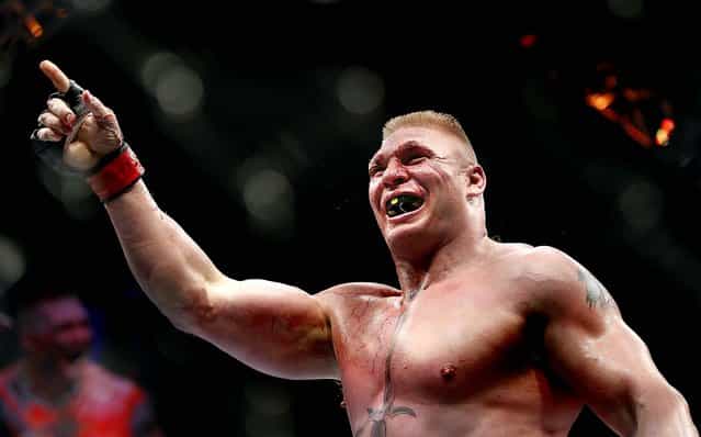 Brock Lesnar celebrates his second round victory over Shane Carwin during their UFC heavyweight mixed martial arts title match at The MGM Grand Garden Arena in Las Vegas. (Photo by Eric Jamison/Associated Press)