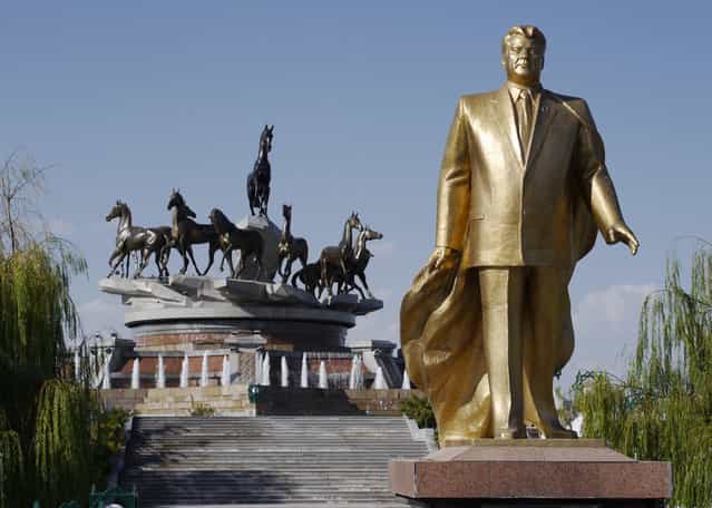 One of many golden statues of Saparmurat Niyazov, former President for Life of Turkmenistan, with native Akhal-Teke horses depicted atop a monument marking 10 years of independence. The hardy desert horse is Turkmenistan's national symbol, and a passion of the current president, Gurbanguly Berdimuhamedow. In his book The Flight of Celestial Racehorse, Berdimuhamedow aligns himself with the noble Akhal-Teke breed in one of the more bizarre quotes from the book: [Riding on horse, driving plane steering wheel, sea liner, driving powerful (truck), Gurbanguly Berdimuhamedov not just demonstrates wonderful physical shape and high professional skills in every business, he fixes in people's minds the image of modern (strongman), who has to do a lot. He must be well-educated, physically strong and esthetically erudite]. Unfortunately for Berdimuhamedow, a festival to celebrate the horses earlier this year ended with the president taking a spectacular fall which was shared widely on YouTube. (Photo by Amos Chapple via The Atlantic)