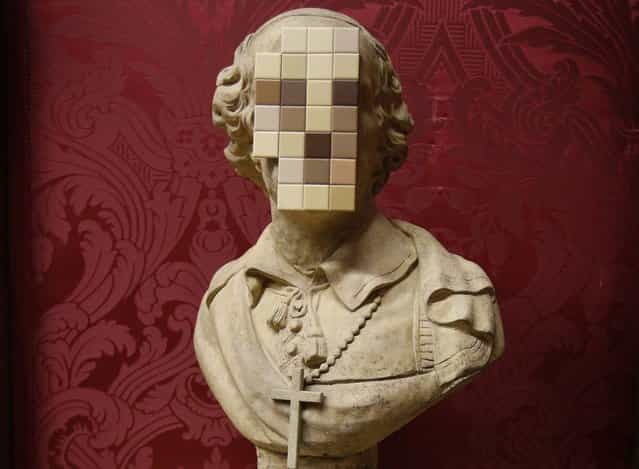[Cardinal Sin] a new work by British artist Banksy is unveiled at the Walker Art Gallery in Liverpool Liverpool, northern England December 16, 2011. The piece made up of an 18th century replica stone bust of a cardinal with the face sawn off and replaced with a mosaic of bathroom tiles is thought to be a comment on the abuse scandal in the church and its subsequent cover-up, the gallery said in a press release. (Photo by Phil Noble/Reuters)
