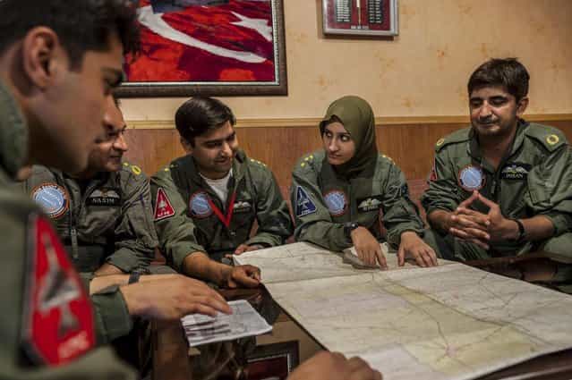 Ayesha Farooq, 26, (2nd R) Pakistan's only female war-ready fighter pilot, attends a briefing with colleagues at Mushaf base in Sargodha, north Pakistan June 6, 2013. (Photo by Zohra Bensemra/Reuters)