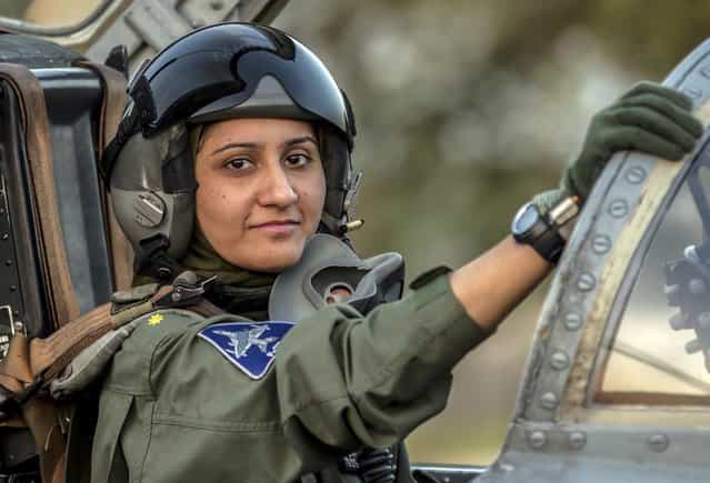 Ayesha Farooq, 26, Pakistan's only female war-ready fighter pilot, poses for photograph as she sits in the cockpit of a Chinese-made F-7PG fighter jet at Mushaf base in Sargodha, north Pakistan June 6, 2013