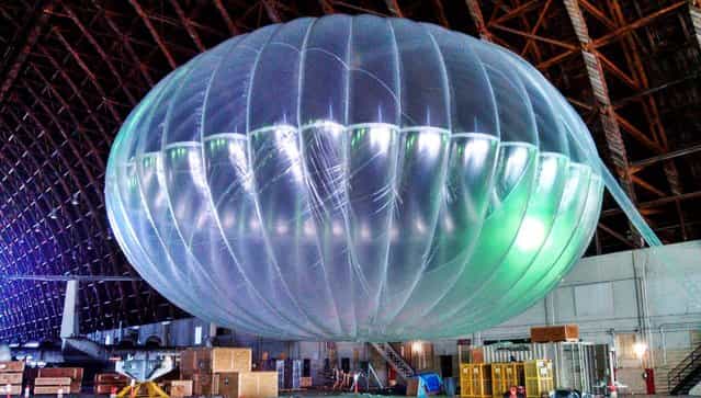 A fully inflated test balloon sits in a hangar at Moffett Field airfield in California. Google is testing the balloons which sail in the stratosphere and beam the Internet to Earth. (Photo by Andrea Dunlap/Google)