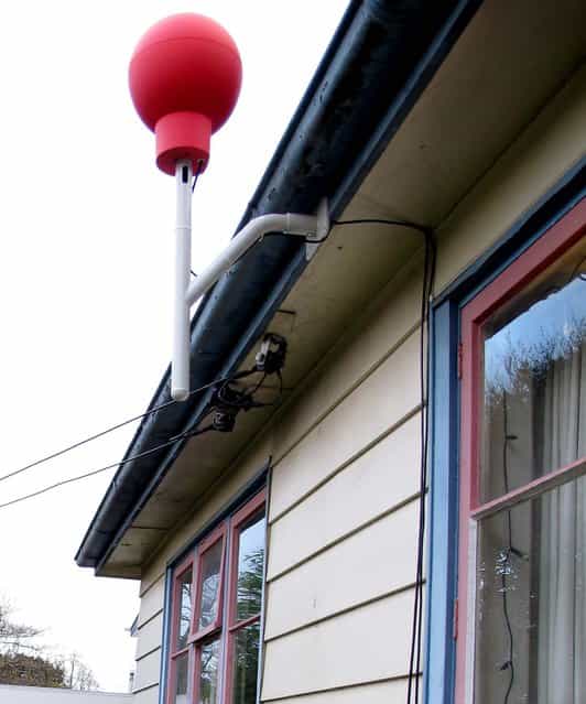 The red Google Internet receiver is set at a home in Christchurch, New Zealand. (Photo by Nick Perry/Associated Press)