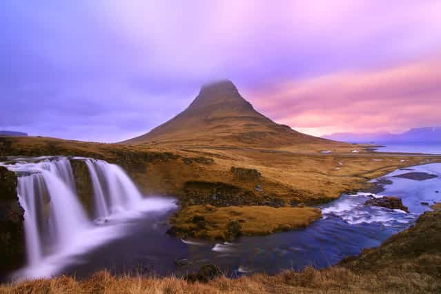 [Dreamy Waterfalls]. Kirkjufellsfoss Waterfalls is located in West Iceland. An amazing place to be for a Landscape Photographer. The Kirkjufell Mountain has created an ideal backdrop for the falls and the sun creates amazing color in that Arctic region during sunset. (Photo and caption by Neloy Bandyopadhyay/National Geographic Traveler Photo Contest)