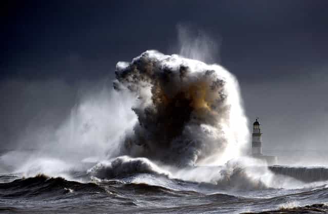 [Raging sea's Seaham 2]. A raging sea Dwarfs Seaham Lighthouse in County Durham in England, with 100ft waves after a cold front moved down from the north bringing freezing temperatures to the North of England. (Photo and caption by Owen Humphreys/National Geographic Traveler Photo Contest)