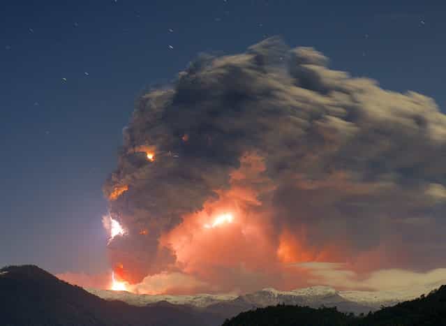 [When the earth speaking ]. Picture of the eruption of the Cordon Caulle. This was taken from the Antillanca mountain. However despite the distance, the sound was awesome and was the most incredible experiences of my life with my uncle, who accompanied me that night. Location: Lakes region, Chile. (Photo and caption by Rival Gustavo/National Geographic Traveler Photo Contest)
