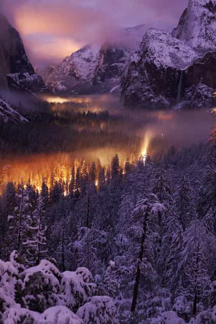 [Yosemite Valley at Night]. The mist on the valley floor reflects car lights driving through. Location: Yosemite National Park. (Photo and caption by Phil Hawkins/National Geographic Traveler Photo Contest)
