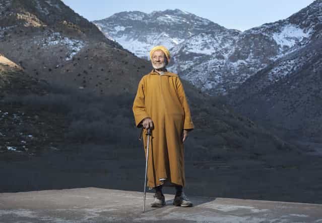 [Guardian of the Mountain]. Hajj claims to be 112 years old. He knew the Europeans that made the first recorded ascent of North Africas highest mountain, Toubkal in 1923. Pictured in the background just catching the last of the evening light. Hajjs' father built and ran the Toubkal mountain refuge passing the responsibility to Hajj and through the generations to his son who is the current guardian. The Guardians of the Mountain. Location: Toubkal, Morocco. (Photo and caption by Joshua Exell/National Geographic Traveler Photo Contest)